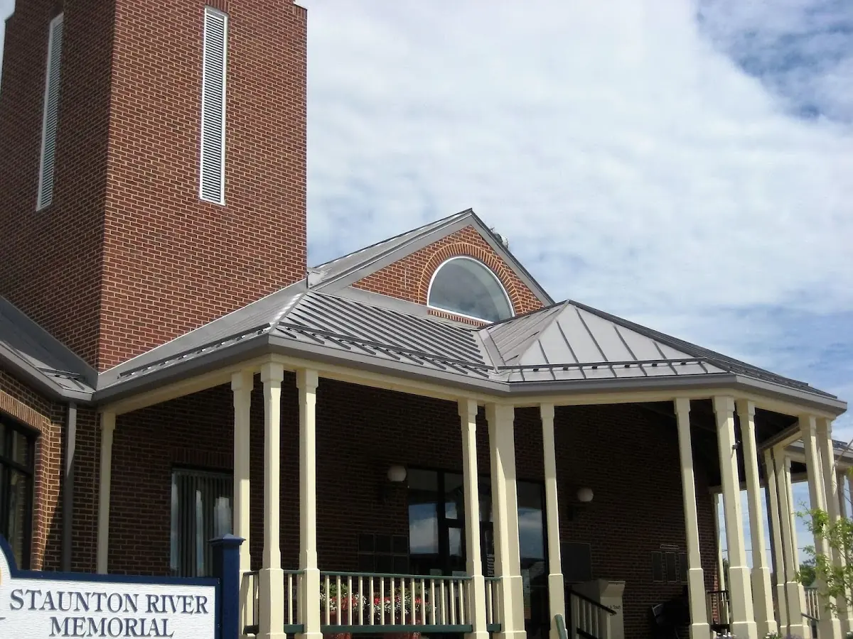 Skilled roofing craftsmen working on a residential roof in Holly Springs